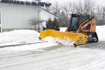 Arctic LD Sno-Pusher clearing a snowy property